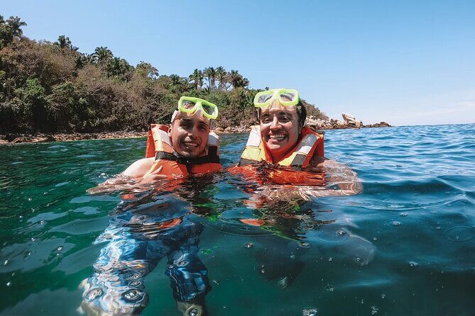 Catamaran Yelapa Beach Tour with Snorkeling, Food and Open Bar - Return to the catamaran: open bar, games, and loud music risk