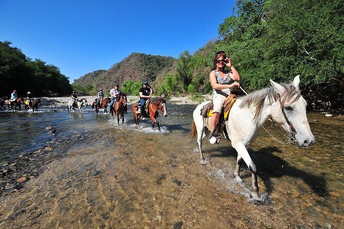 Jungle HorseBack Adventure to Las Palmas Waterfall All Included - Horseback into the Sierra Madre: river ride, rustic neighborhood, and a bay lookout