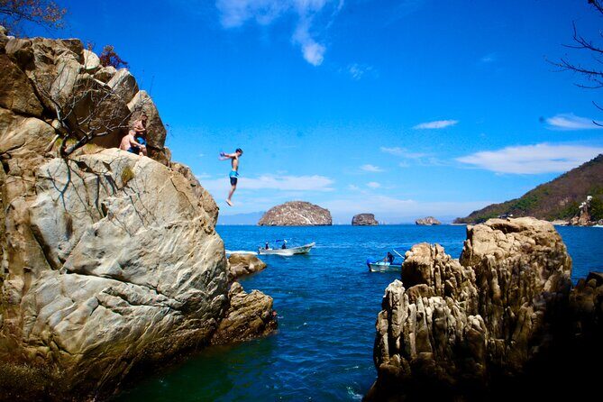 Los Arcos 5 islands Snorkeling Cliff Jumping and Hidden Beach - Playa Mismaloya: Shops, sea air, and the Iguana movie set rocks