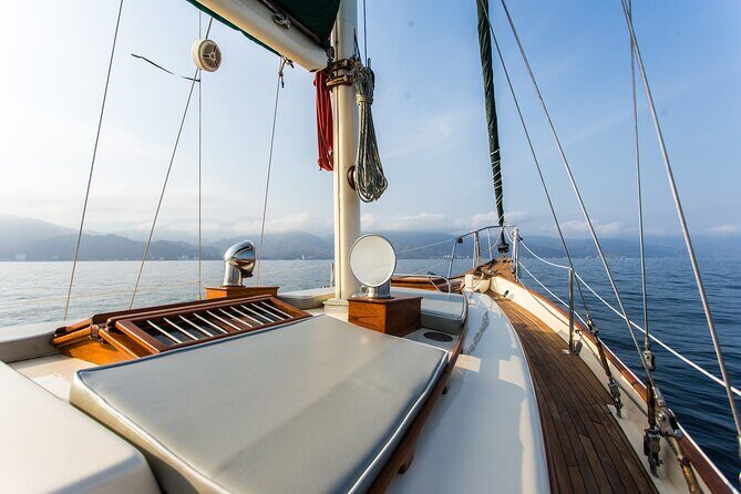 Luxury Puerto Vallarta Shared Sailing Tour: Sail, Swim & Dine - Back Toward the Malecon: Arches and Church From Offshore