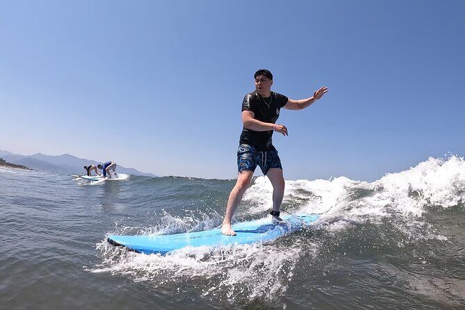 Surf classes in Puerto Vallarta with local instructors - What’s Included: Board, Leash, Rashguard, Shade, and Fuel
